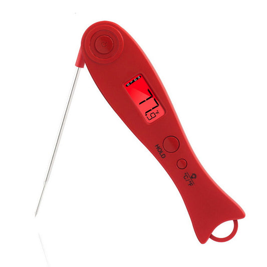 Red TempCore instant-read digital food thermometer measuring temperature inside grilled meat