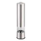 Stainless steel GrindEase electric salt and pepper mill dispensing ground pepper onto a plate